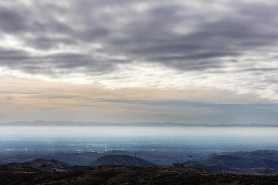 The effects of an inversion are seen looking south over Boise from Bogus Basin Road on Nov. 27, 2021. A cold-weather inversion occurs when cooler air gets trapped close to the surface below a layer of warmer air.