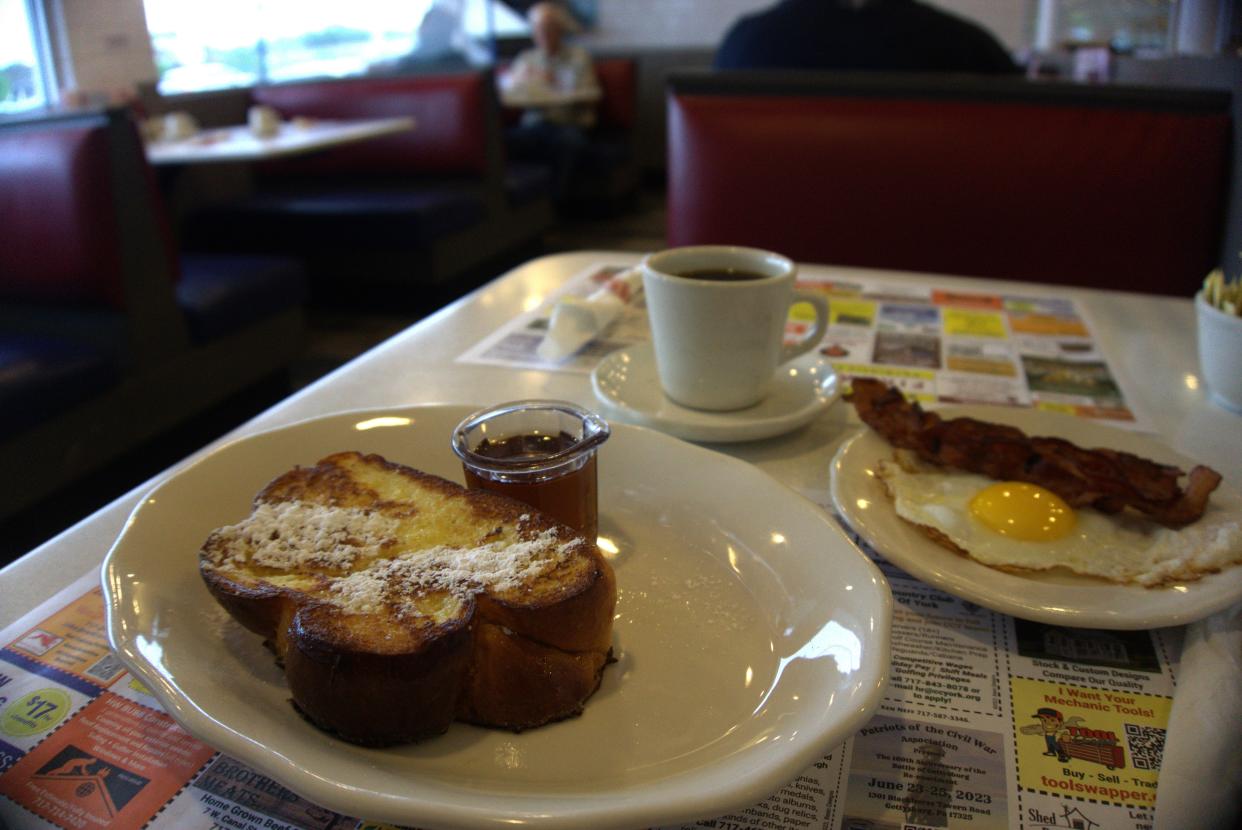 An order of Brioche French Toast, alongside bacon, egg and a fresh, hot cup of coffee is how I start my morning shift at Round the Clock Diner on Arsenal Road in York.