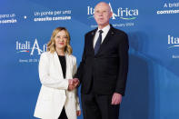 Italian Premier Giorgia Meloni, left, welcomes President of Tunisia Kais Saied on the occasion of an Italy - Africa summit, in Rome, Monday, Jan. 29, 2024. Meloni opened a summit of African leaders on Monday aimed at illustrating Italy's big development plan for the continent that her government hopes will stem migration flows and forge a new relationship between Europe and Africa. (Roberto Monaldo/LaPresse via AP)