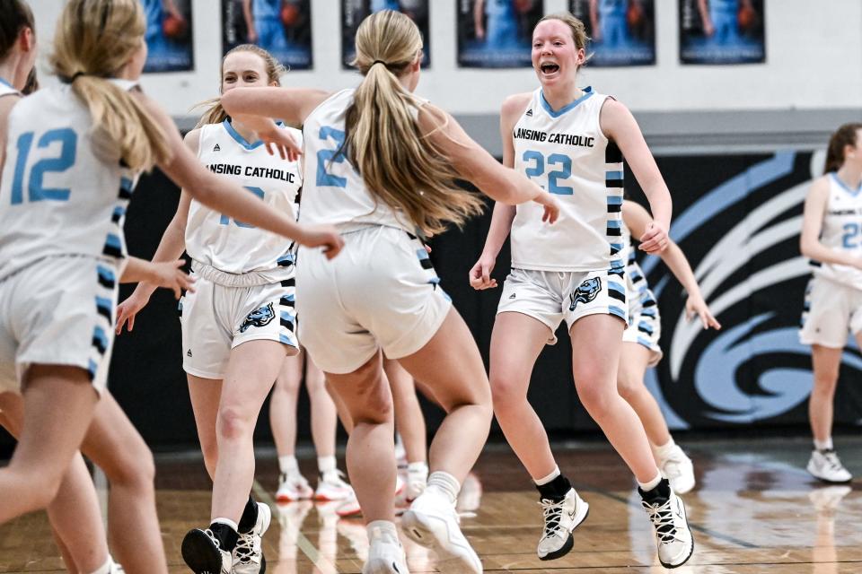 Lansing Catholic celebrates after beating Portland on Friday, Jan. 14, 2022, at Lansing Catholic High School in Lansing.