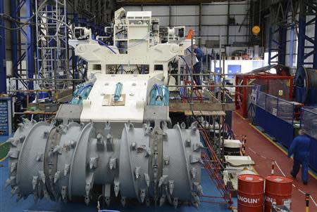 Employees of Soil Machine Dynamics (SMD) work on a subsea mining machine being built for Nautilus Minerals at Wallsend, northern England April 14, 2014. REUTERS/ Nigel Roddis