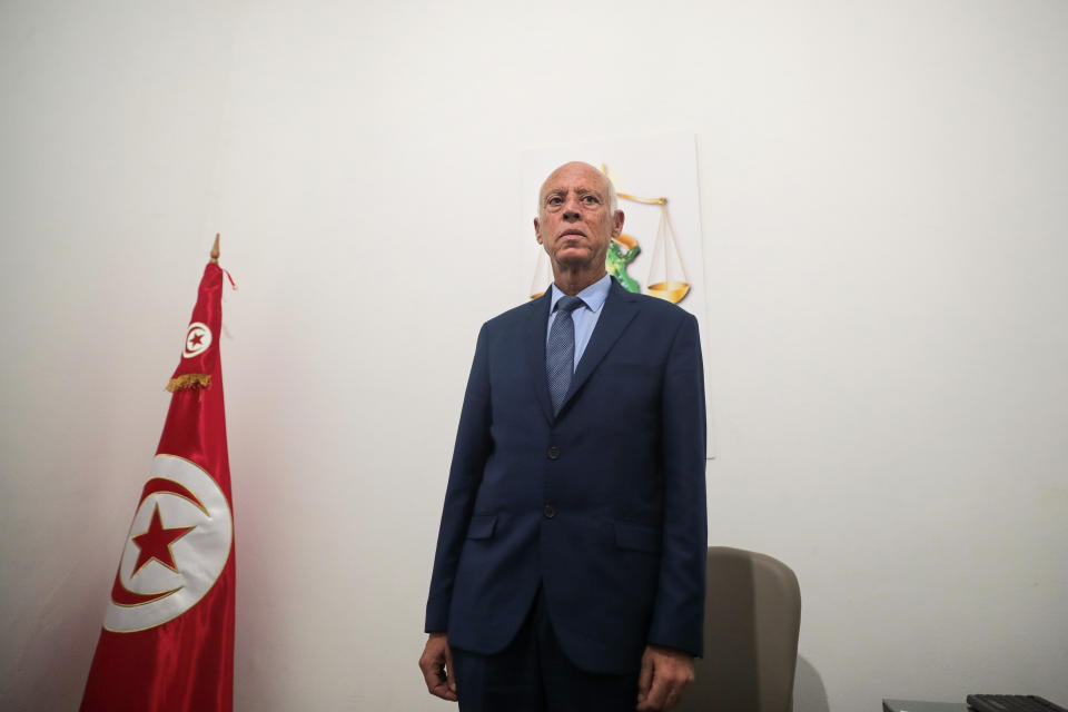 Tunisian former conservative constitutional law professor Kais Saied poses in his office in Tunis, Tunisia, Tuesday, Sept. 17, 2019. With more than half the votes in Tunisia's presidential race counted, Kais Saied was in the lead. Media magnate Nabil Karoui, a more modernizing candidate, was in second place with 15.5%. (AP Photo/Mosa'ab Elshamy)