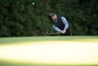 Justin Thomas chips onto the 12th green during the second round of the Genesis Invitational golf tournament at Riviera Country Club, Friday, Feb. 19, 2021, in the Pacific Palisades area of Los Angeles. (AP Photo/Ryan Kang)