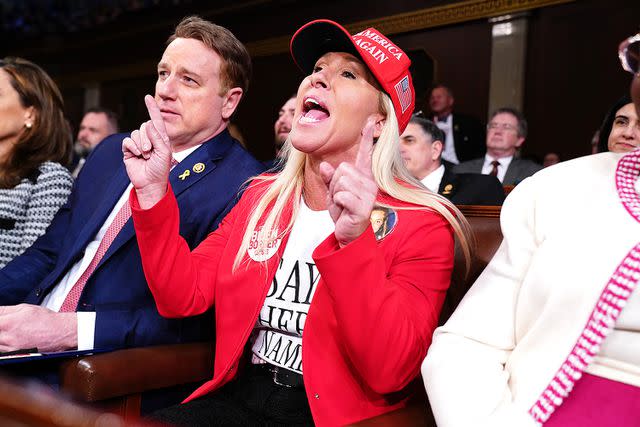 <p>Shawn Thew-Pool/Getty Images</p> Marjorie Taylor Greene shouts during the March 2024 State of the Union address