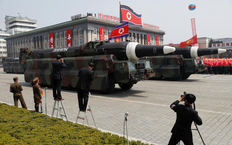 Missiles are driven past the stand during a military parade marking the 105th birth anniversary of country's founding father in Pyongyang - REUTERS