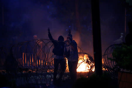 Protesters gesture during a riot near the Election Supervisory Agency (Bawaslu) headquarters in Jakarta, Indonesia, May 22, 2019. REUTERS/Willy Kurniawan