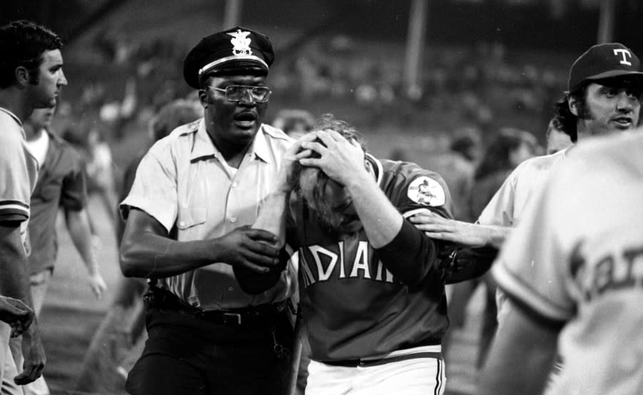 CLEVELAND, OH – JUNE 4,1974: Pitcher Tom Hilgendorf #40 of the Clevleand Indians is helped off the field after suffering a minor injury during a game against the Texas Rangers on June 4, 1974 at Cleveland Municipal Stadium in Cleveland, Ohio. Texas was awarded a win by forfeit 5-5 when the game was called by the umpires, due to fans storming the field during 10 cent beer night. (Photo by: Paul Tepley Collection/Diamond Images/Getty Images)