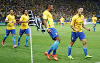 Football Soccer - Brazil v Paraguay - World Cup 2018 Qualifiers - Arena Corinthians stadium, Sao Paulo, Brazil - 28/3/17 - Brazil's Philippe Coutinho (R) celebrates his goal with his teammates. REUTERS/Nacho Doce