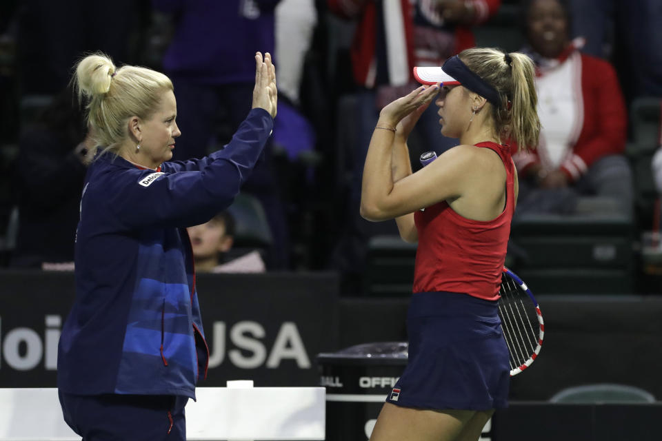 United States' captain Kathy Rinaldi, left, greets Sofia Kenin after Kenin won her second set, after losing the first, against Latvia's Jelena Ostapenko during a Fed Cup qualifying tennis match Saturday, Feb. 8, 2020, in Everett, Wash. (AP Photo/Elaine Thompson)