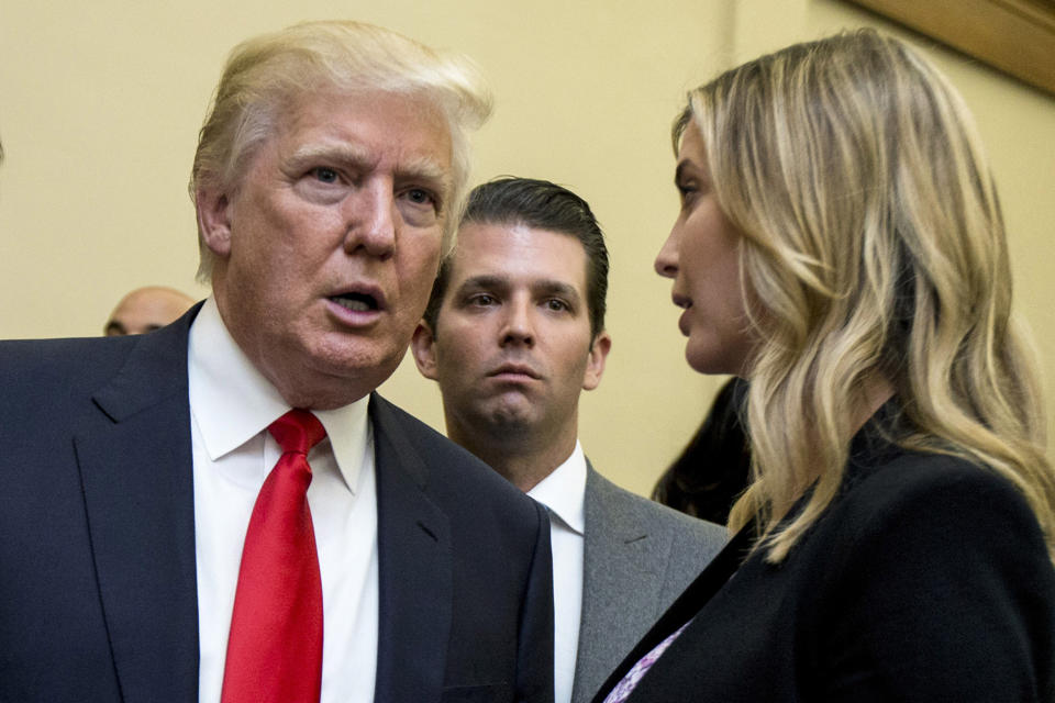 FILE - Donald Trump, left, his son Donald Trump Jr., center, and his daughter Ivanka Trump speak during the unveiling of the design for the Trump International Hotel in the The Old Post Office, in Washington, on Sept. 10, 2013. New York's attorney general sued former President Donald Trump and his company, on Wednesday, Sept. 21, 2022, alleging business fraud involving some of their most prized assets, including properties in Manhattan, Chicago and Washington, D.C. (AP Photo/Manuel Balce Ceneta, File)