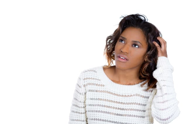 Closeup portrait of young woman thinking daydreaming deeply about something scratching head looking upwards, isolated on white b