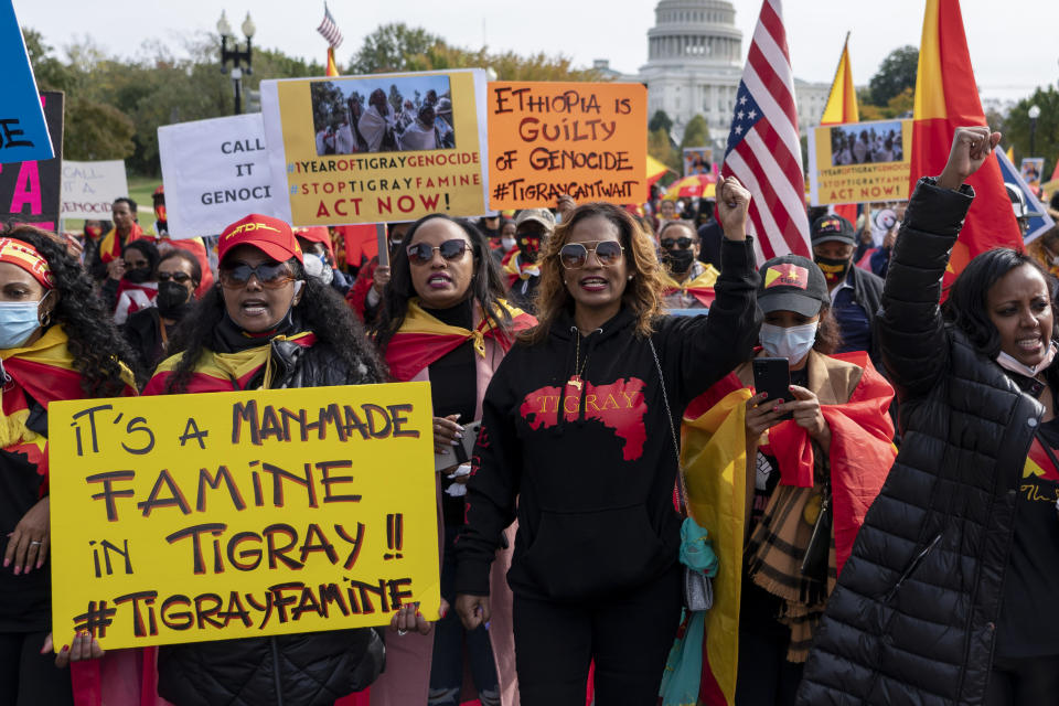 FILE - Members of the Tigrayan diaspora and their supporters march to mark one year since the start of the conflict in Tigray, the northernmost region in Ethiopia, at the U.S. Capitol, Thursday, Nov. 4, 2021, in Washington. In 2023 urgently needed grain and oil have disappeared again for millions caught in a standoff between Ethiopia's government, the United States and United Nations over what U.S. officials say may be the biggest theft of food aid on record. (AP Photo/Gemunu Amarasinghe, File)