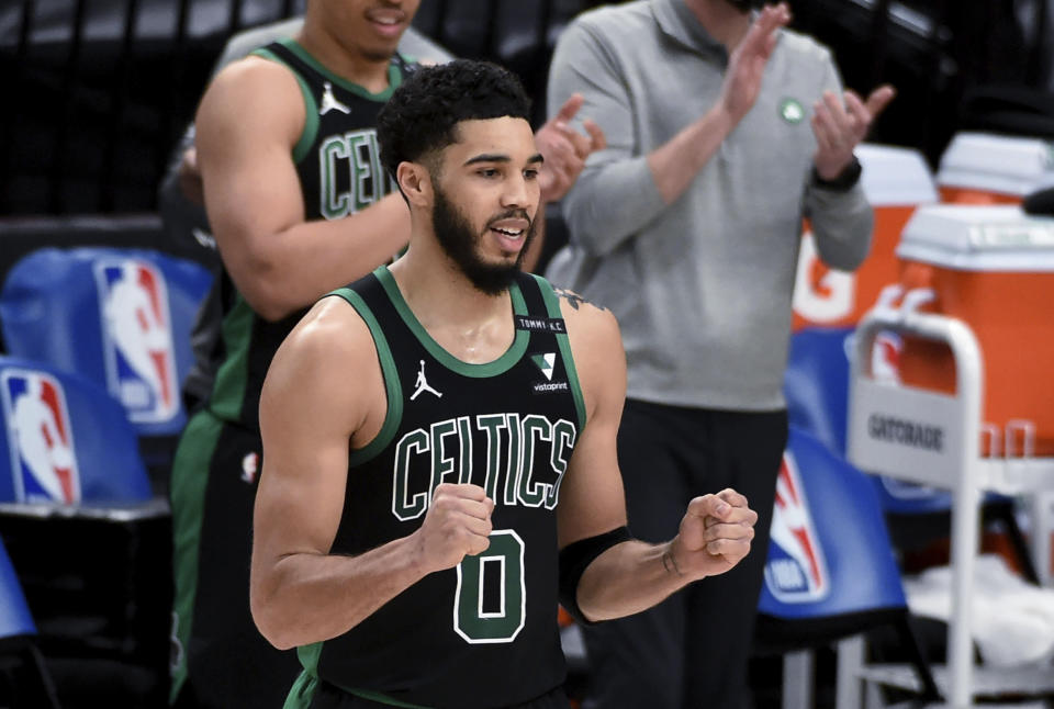 Boston Celtics forward Jayson Tatum rects as the buzzer sounds and the Celtics defeat the Portland Trail Blazers in an NBA basketball game in Portland, Ore., Tuesday, April 13, 2021. The Celtics won 116-115. (AP Photo/Steve Dykes)