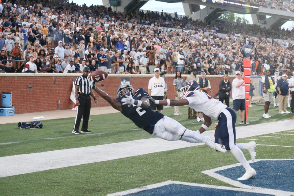 Georgia Southern wide receiver Derwin Burgess Jr. reaches to make a 12-yard touchdown grab with 1:28 left in the second quarter as quarterback Kyle Vantrease lofted the pass where only his receiver could possibly catch it. 