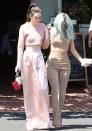 <p>Sisters that wear crop tops together, stay together. The Jenners hit the streets of Hollywood to shop in coordinated looks. Kendall opted for a pink long sleeved “shirt” by Jonathan Simkhai with a coordinated maxi skirt, while Kylie wore a suede version with matching pants.</p>