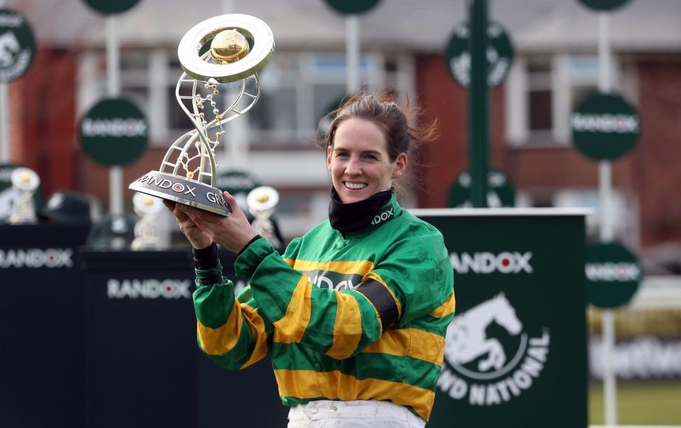 Jockey Rachael Blackmore receives the Randox Grand National Handicap Chase trophy after winning on Minella Times during Grand National Day of the 2021 Randox Health Grand National Festival at Aintree Racecourse, Liverpool. - PA