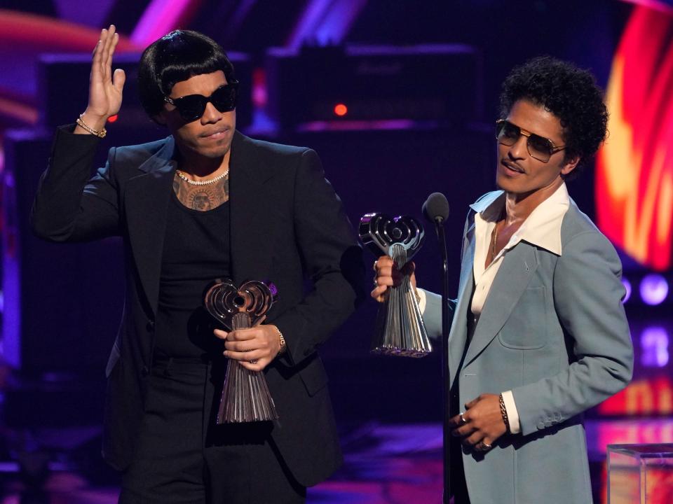 Anderson .Paak, left, and Bruno Mars of Silk Sonic accept the award for best duo/group of the year at the iHeartRadio Music Awards on Tuesday, March 22, 2022, at the Shrine Auditorium in Los Angeles.