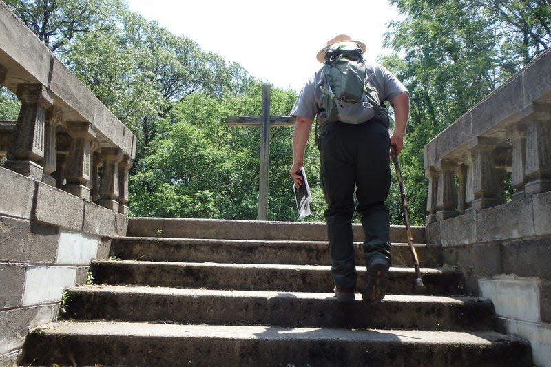 Ranger Bill Smith leads hikers to the top of the historic Bailly Cemetery a few years ago in the Indiana Dunes National Park. Joseph Dits, South Bend Tribune file