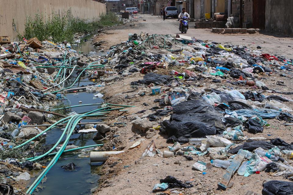 In this Saturday, July, 20, 2019 photo, potable water pipes mix with sewage at a garbage dump in Basra, southeast of Baghdad, Iraq. A leading rights group says Iraq's government is failing to properly address underlying causes for an ongoing water crisis in the country's south. A report released on Monday by Human Rights Watch on chronic water shortages and pollution in Iraq's Basra province says authorities continue to allow activities that pollute the province's water resources despite the health risks to residents. (AP Photo/Nabil al-Jurani)