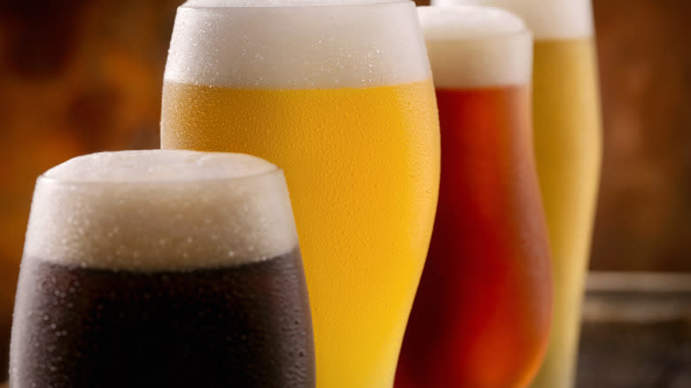 closeup of beers in different glasses