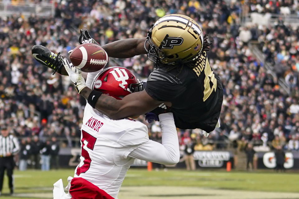 Indiana defensive back Kobee Minor (5) breaks up a pass to Purdue wide receiver Deion Burks (4) during the second half of an NCAA college football game in West Lafayette, Ind., Saturday, Nov. 25, 2023. Minor was called for pass interference on the play. Purdue defeated Indiana 35-31. (AP Photo/Michael Conroy)