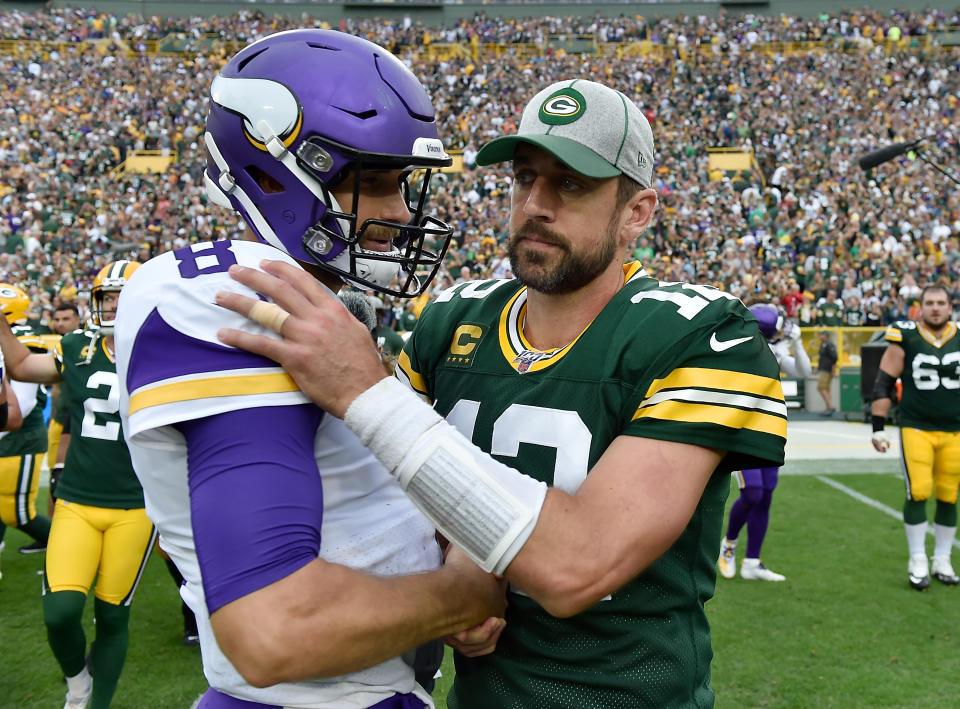 Kirk Cousins of the Minnesota Vikings (left) and Aaron Rodgers of the Green Bay Packers talk after a game at Lambeau Field in 2019. (Quinn Harris/Getty Images)