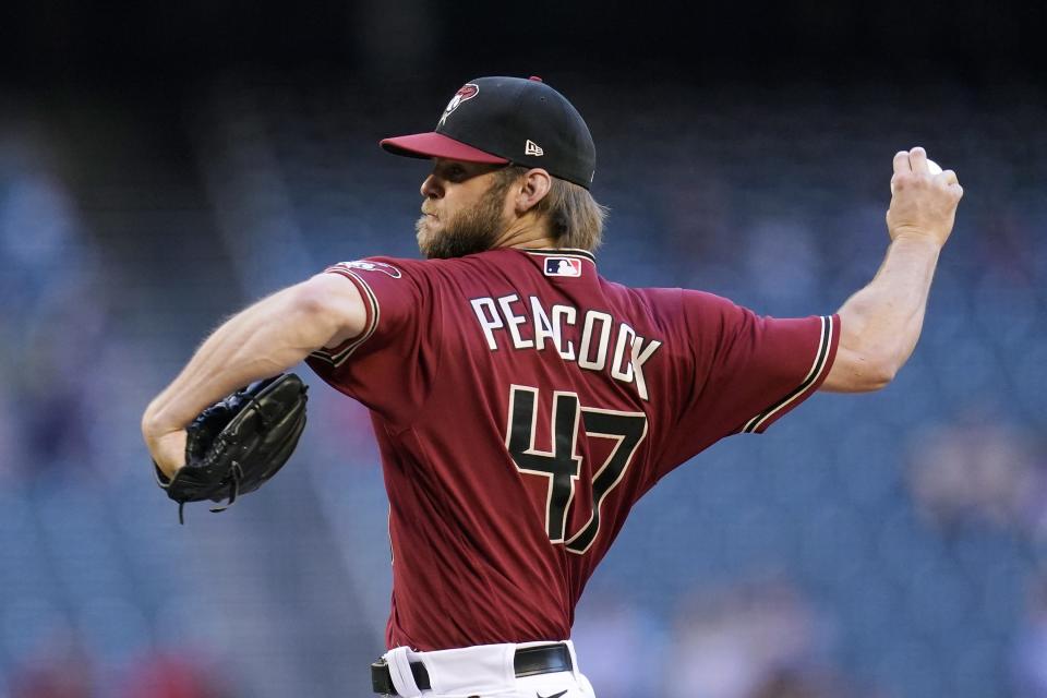 Arizona Diamondbacks starting pitcher Matt Peacock throws against the Miami Marlins during the first inning of a baseball game Wednesday, May 12, 2021, in Phoenix. (AP Photo/Ross D. Franklin)