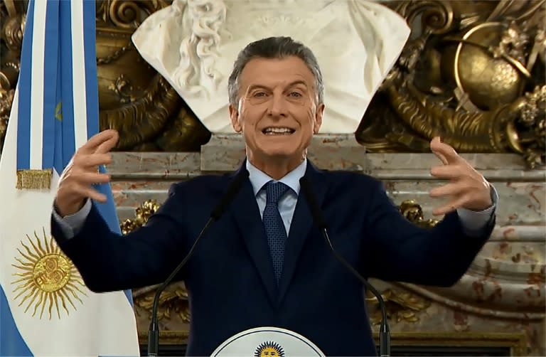 Screen grab from an Argentine government video showing President Mauricio Macri delivering a nationally televised message to announce austerity measures, including the elimination of some government ministries and imposition of new taxes on exports to reduce budget deficits and stabilize the economy