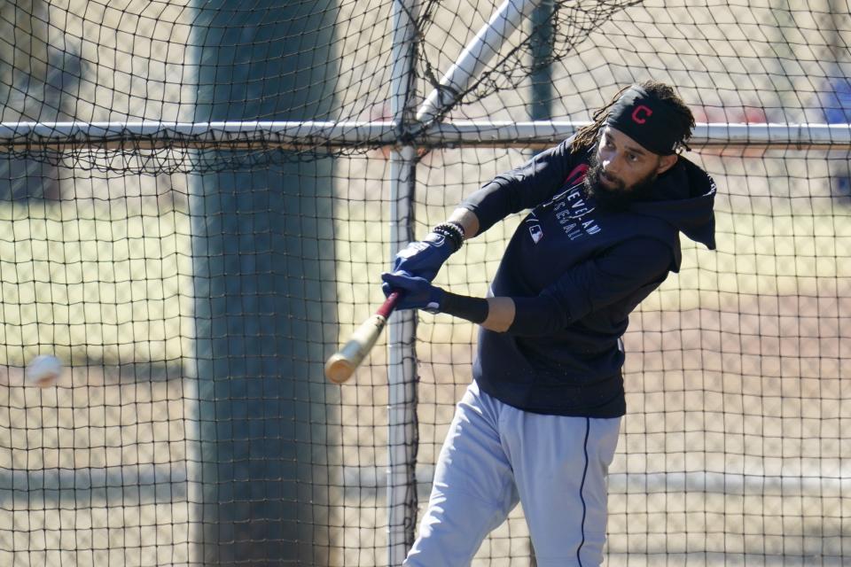 Cleveland Indians' Billy Hamilton connects with a baseball in batting practice during a spring training baseball practice Monday, Feb. 22, 2021, in Goodyear, Ariz. (AP Photo/Ross D. Franklin)