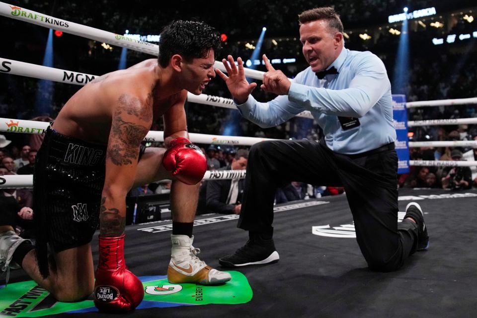 Referee Thomas Taylor counts out Ryan Garcia, who was knocked down by Gervonta Davis in a lightweight boxing bout Saturday, April 22, 2023, in Las Vegas.