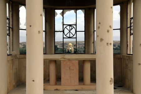 A part of a deserted church is seen in an area recently cleared of mines and unexploded ordnance in a project to clear the area near Qasr Al-Yahud, a traditional baptism site along the Jordan River, near Jericho in the occupied West Bank, December 9, 2018. REUTERS/Ammar Awad