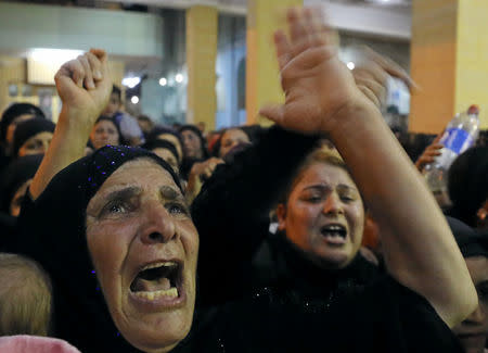 Relatives of victims of an attack that killed at least 28 Coptic Christians on Friday react at the funeral in Minya, Egypt May 26, 2017. REUTERS/Mohamed Abd El Ghany