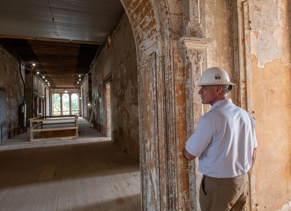 June 27, 2022; Tuscaloosa, AL, USA; Tim Leopard, University of Alabama senior associate vice-president of campus development, examines the work in Bryce Main. The new east wing is going up at Bryce Main after the original wing had to be demolished, while reconstruction on the west wing and central wings of the building continue. Gary Cosby Jr.-The Tuscaloosa News