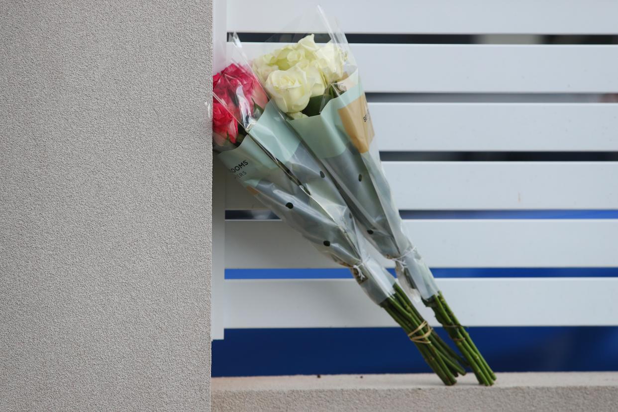 Flowers delivered by a member of the public rest against a fence at Christ The Good Shepherd Church in the suburb of Wakeley on 16 April 2024 in Sydney, Australia (Getty Images)