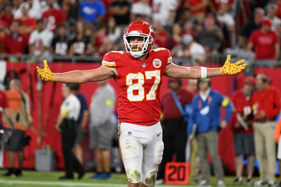 Kansas City Chiefs tight end Travis Kelce (87) celebrates a first down during the second half of an NFL football game against the Tampa Bay Buccaneers Sunday, Oct. 2, 2022, in Tampa, Fla. (AP Photo/Jason Behnken)