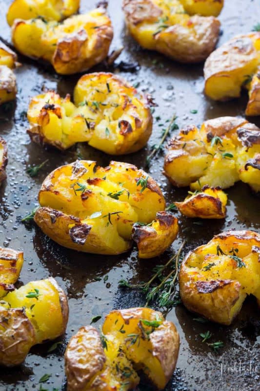 <p>Noshtastic</p><p>Smashed red potatoes baked with garlic, olive oil and herbs, fluffy in the middle and truly crispy on the top!!</p><p><strong>Get the recipe: <a href="https://www.noshtastic.com/smashed-potatoes/" rel="nofollow noopener" target="_blank" data-ylk="slk:Really Crispy Smashed Red Potatoes;elm:context_link;itc:0;sec:content-canvas" class="link ">Really Crispy Smashed Red Potatoes</a></strong></p>