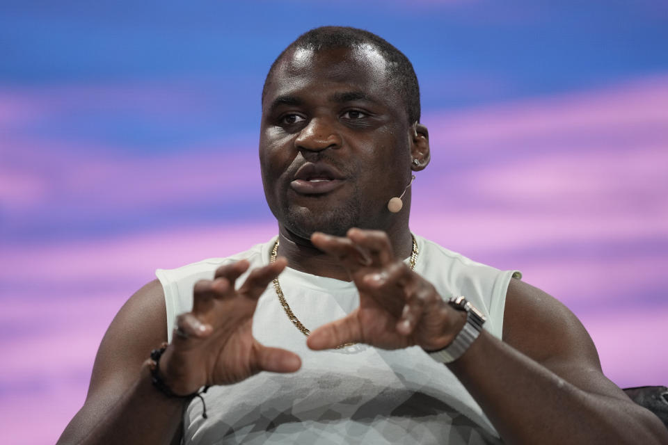 FILE - Cameroonian mixed martial artist Francis Ngannou speaks during a panel at the Bitcoin Conference, Thursday, April 7, 2022, in Miami Beach, Fla. Mike Tyson will present three winners a custom championship belt Saturday, Feb. 24, 2024, at the PFL vs. Bellator: Champs card in Saudi Arabia. Former UFC heavyweight champion Francis Ngannou is expected to be on hand to challenge the winner of the heavyweight fight on the PFL card. (AP Photo/Rebecca Blackwell, File)