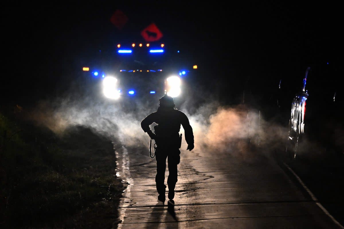 Law enforcement on the scene of search for Robert Card  (AFP via Getty Images)