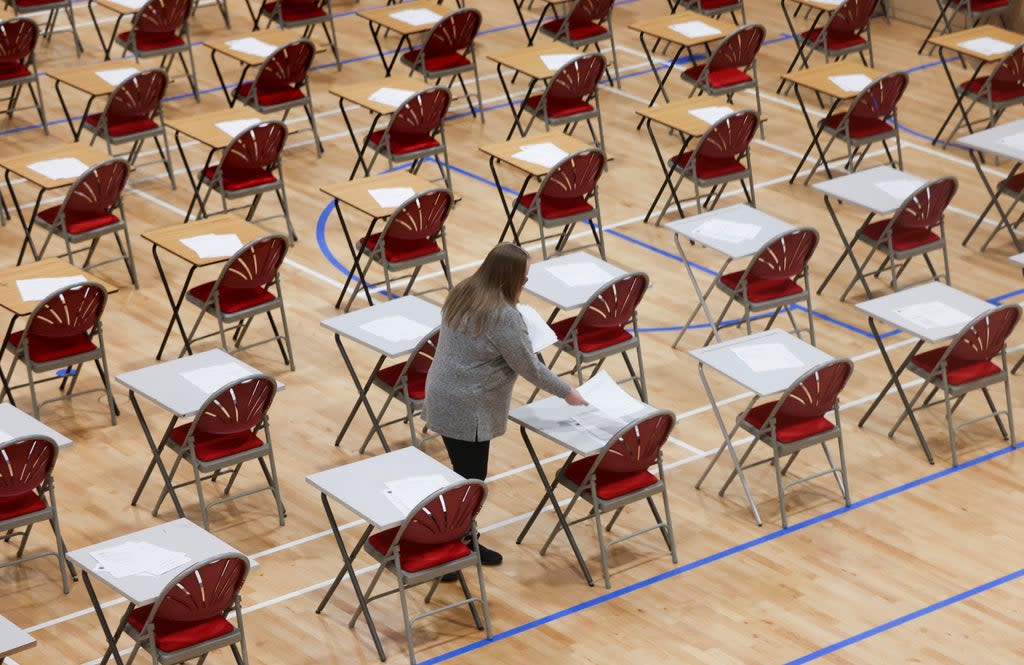 A teacher lays out exams at Fulham Boys School  (REUTERS)