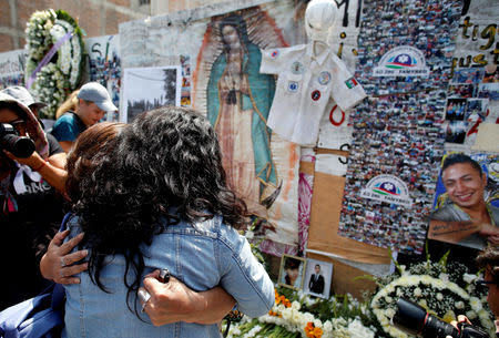 Women react for their relative, that died in a building that collapsed during the September 2017 earthquake, after a minute of silence to honour the victims of the quake in Mexico City, Mexico September 19, 2018. REUTERS/Gustavo Graf