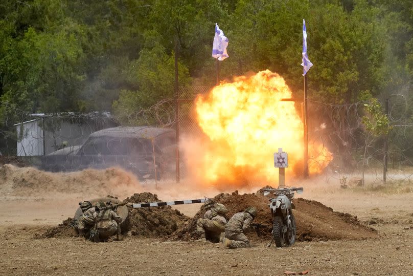 Fighters from the Lebanese militant group Hezbollah carry out a training exercise in Aaramta village in the Jezzine District, southern Lebanon, Sunday, May 21, 2023.