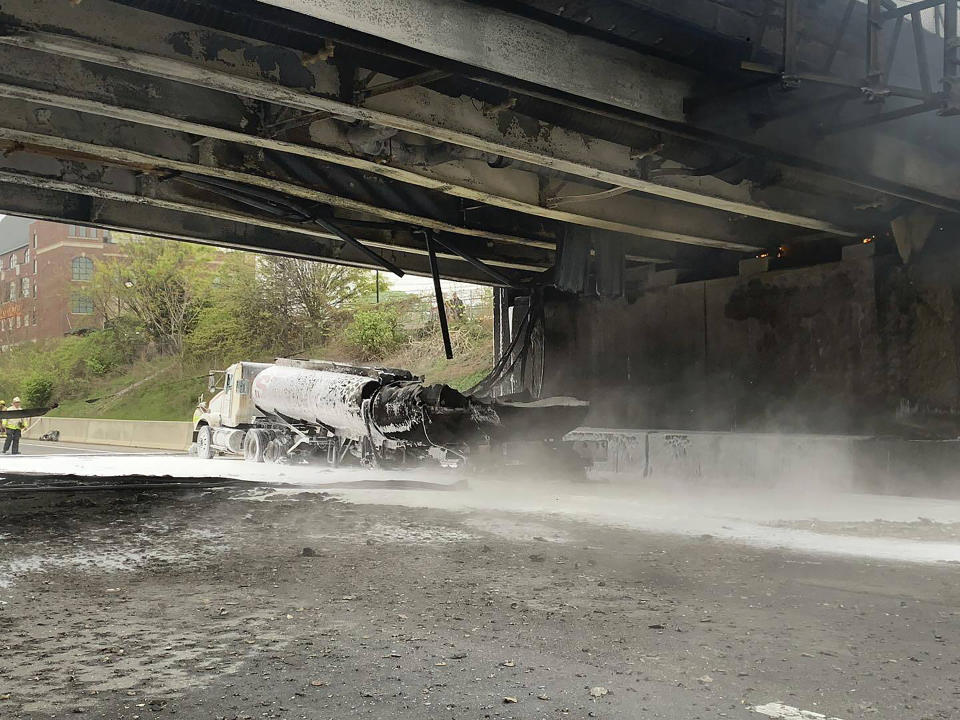 This image provided by the Norwalk Police Department shows the scene of a tanker fire on I-95 in Norwalk, Conn., Thursday, May 2, 2024. Both sides of I-95, the East Coast's main north-south highway, were shut down following the early morning crash involving a passenger car, a tractor-trailer and a tanker truck carrying 8,500 gallons (about 32,000 liters) of gasoline. (Norwalk Police Department via AP)