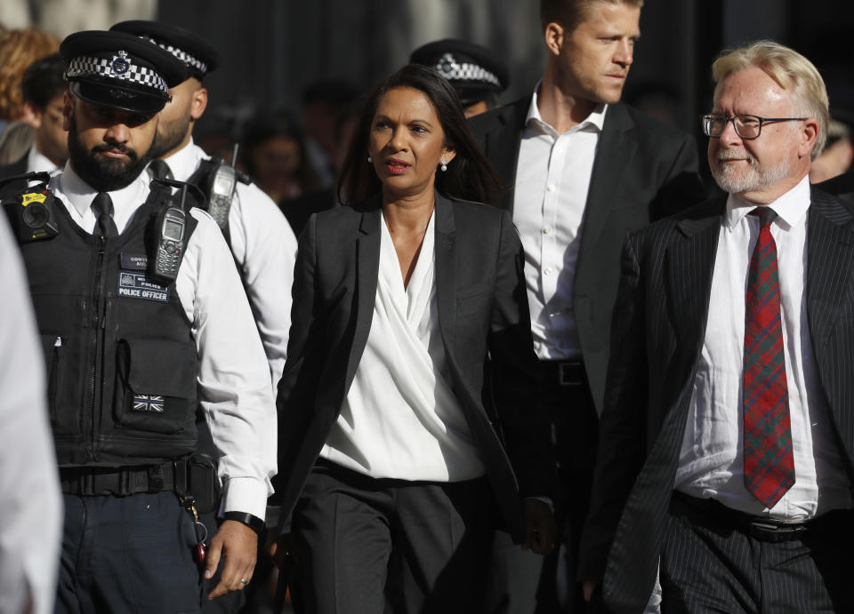 Anti-Brexit campaigner Gina Miller, center, arrives at The Supreme Court in London, Thursday, Sept. 19, 2019. The Supreme Court is set to decide whether Prime Minister Boris Johnson broke the law when he suspended Parliament on Sept. 9, sending lawmakers home until Oct. 14 — just over two weeks before the U.K. is due to leave the European Union. (AP Photo/Alastair Grant)