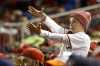 A fan gestures the baby shark as Washington Nationals' Gerardo Parra bats during the sixth inning of Game 3 of the baseball World Series Houston Astros Friday, Oct. 25, 2019, in Washington. (AP Photo/Patrick Semansky)