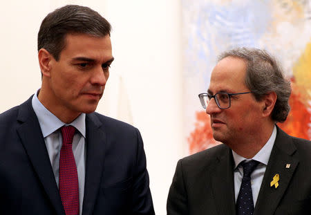 Spain's Prime Minister Pedro Sanchez and Catalan Regional President Quim Torra talk after a meeting at Palau Reial de Pedralbes in Barcelona, Spain December 20, 2018. REUTERS/Albert Gea