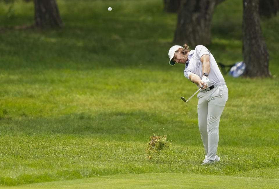Tommy Fleetwood, of England, hits his approach shot out of the rough on the second hole during the third round of the Canadian Open golf championship in Toronto, Ontario, Saturday, June 10, 2023. (Nathan Denette/The Canadian Press via AP)