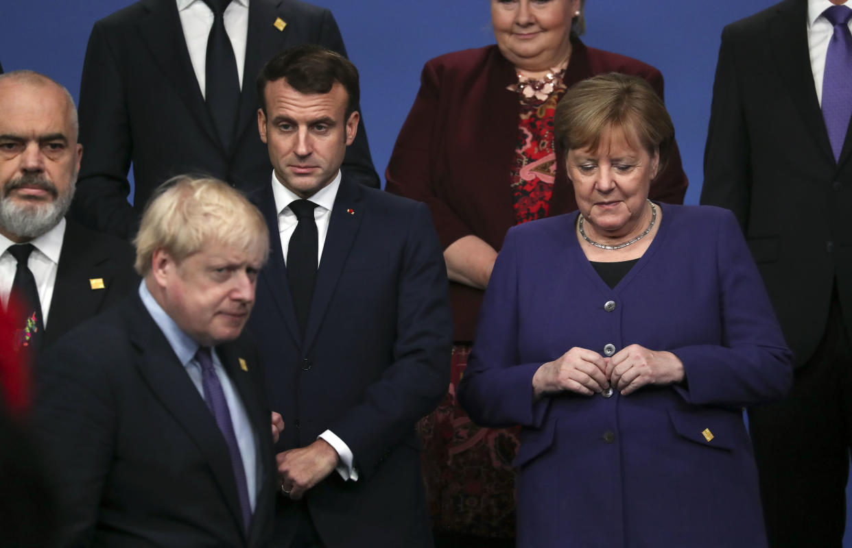 British Prime Minister Boris Johnson, President of France Emmanuel Macron and Chancellor of Germany Angela Merkel stand onstage during the annual NATO heads of government summit on December 4, 2019 in Watford, England. Photo: Steve Parsons-WPA Pool/Getty Images