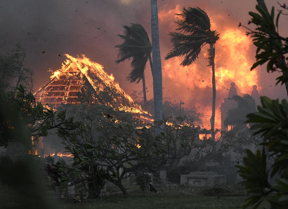 FILE - The hall of historic Waiola Church in Lahaina and nearby Lahaina Hongwanji Mission are engulfed in flames along Wainee Street on Aug. 8, 2023, in Lahaina, Hawaii. (Matthew Thayer/The Maui News via AP, File)