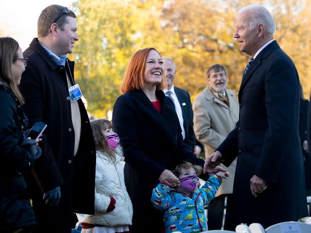 <p>Shutterstock</p> Joe Biden, Jen Psaki and Gregory Mecher at the 74th National Thanksgiving Turkey presentation in 2021