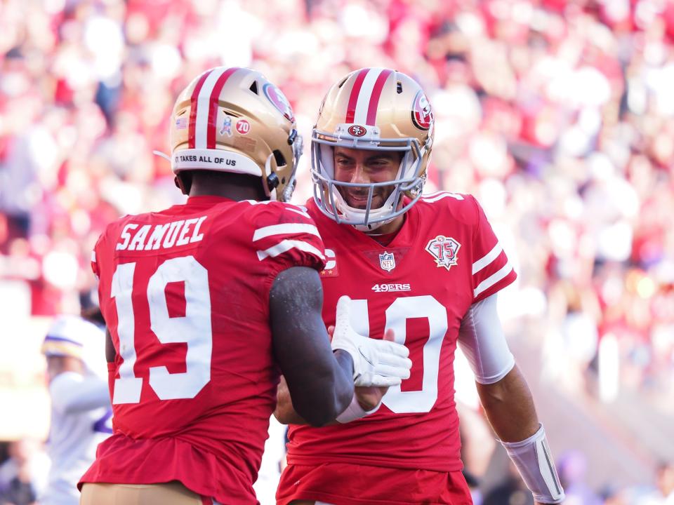 San Francisco 49ers wide receiver Deebo Samuel (19) celebrates with quarterback Jimmy Garoppolo (10) after a touchdown against the Minnesota Vikings during the first quarter at Levi's Stadium.